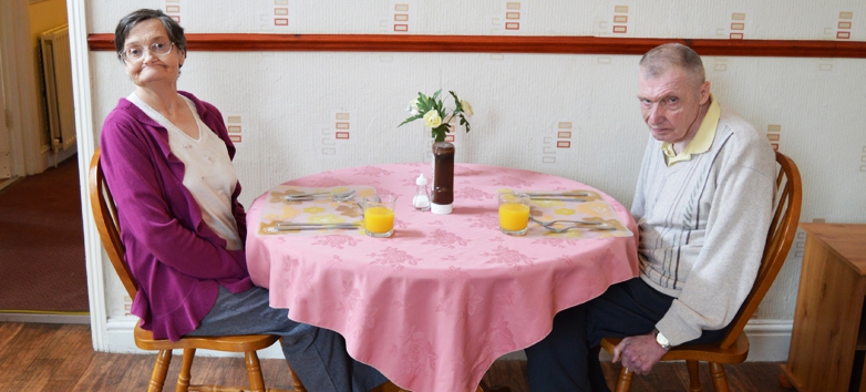 Genesis residential home sitting at the table